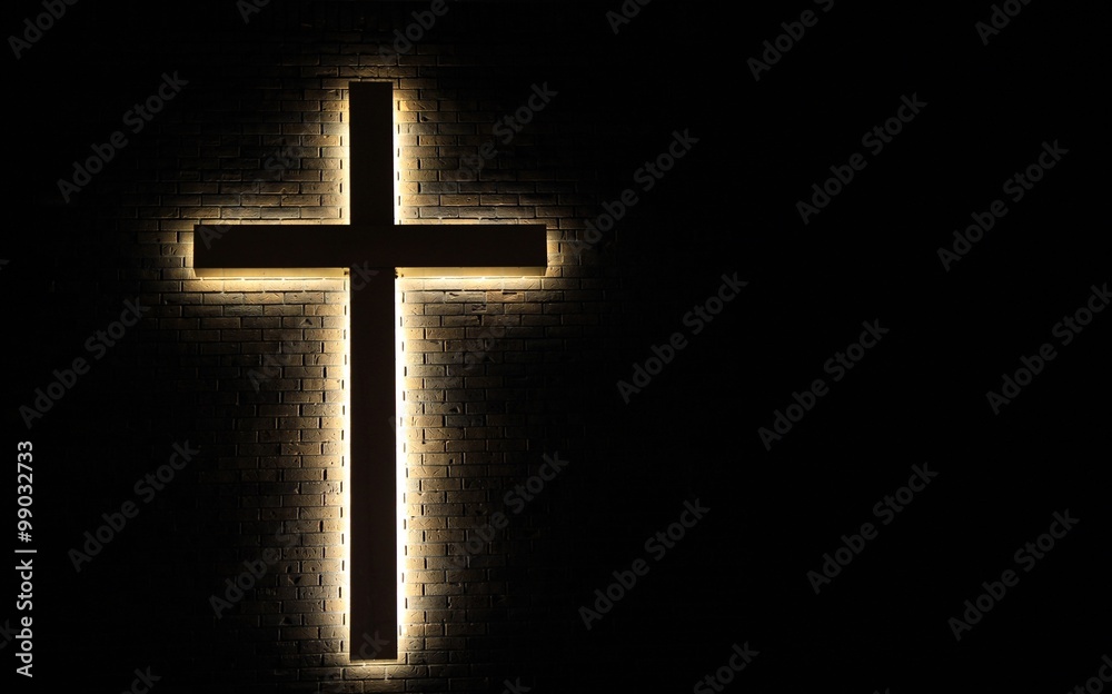 Wall mural lighted cross background. back lit cross on a brick background with copy space. - Wall murals