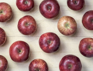 Heirloom Red Delicious Apples  - Set in an array on an old worn Maple cutting board