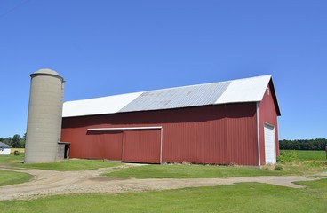 Barn and surrounding farmland in a rural setting