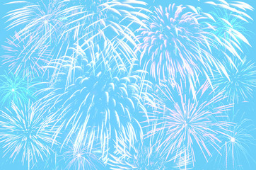 Fireworks celebration on pastel cyan colour background.