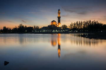 Fototapeta na wymiar Perfect reflection of a floating mosque Masjid Tengku Tengah Zaharah in Kuala Ibai, Terengganu, Malaysia during sunset
