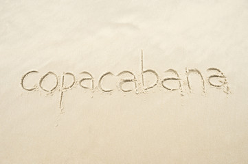 Copacabana, the famous beach, message handwritten on smooth sand in Rio de Janeiro, Brazil