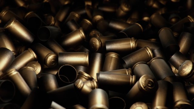 An endless ocean of spent pistol casings.