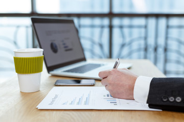 businessman checking financial reports