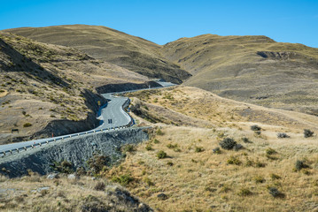 winding road Arrowtown to Wanaka , South Island New Zealand