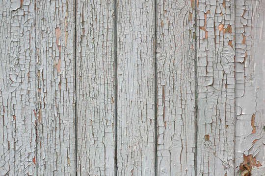 cracked gray paint on boards background.