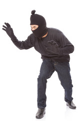 Burglar wearing mask on over white background