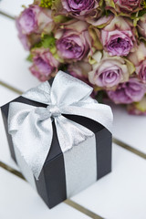 Gift box and flower bouquet