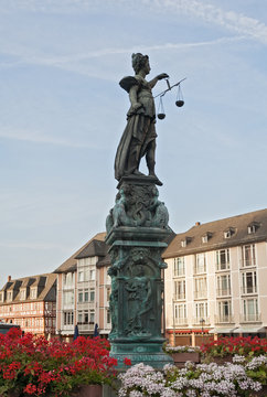 Justitia sculpture on the Roemerberg square in the morning, Frankfurt, Germany