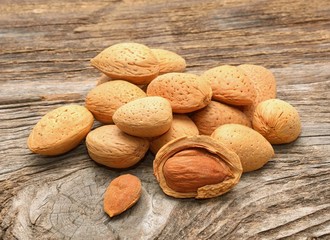 Almonds on wooden background
