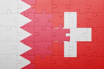 puzzle with the national flag of switzerland and bahrain