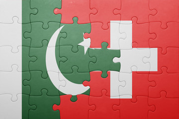 puzzle with the national flag of switzerland and pakistan