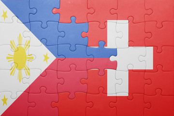 puzzle with the national flag of switzerland and philippines