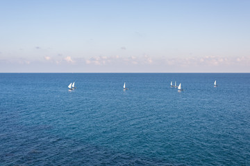 Group of sailing boats on the blue Mediterranean Sea