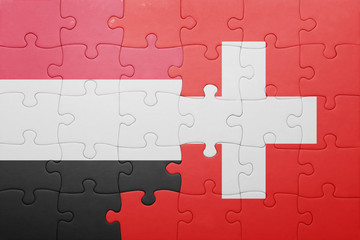Fototapeta premium puzzle with the national flag of switzerland and yemen