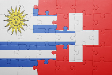 puzzle with the national flag of switzerland and uruguay