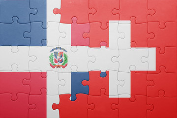 Fototapeta premium puzzle with the national flag of switzerland and dominican