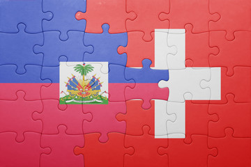 puzzle with the national flag of switzerland and haiti
