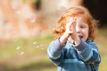 Girl with soap bubbles
