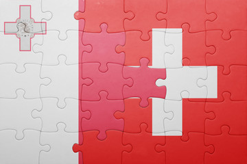 puzzle with the national flag of switzerland and malta