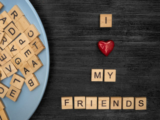 Obraz premium Wooden letters spelling I love my friends