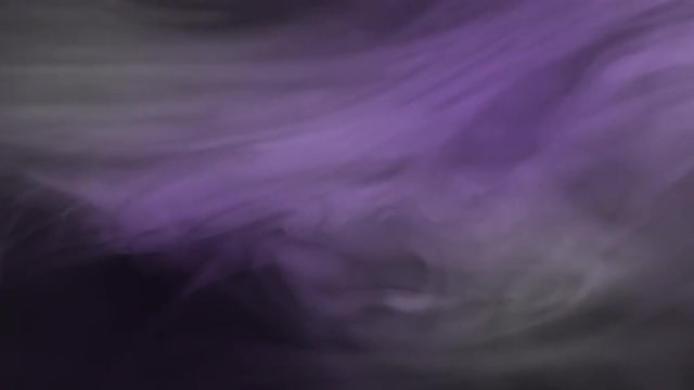 Violet fog drifts across the screen.  Recorded against black and intended as a motion graphics background, for compositing with graphics or using a blending mode.  Looping clip.