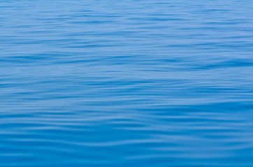 Serene blue ocean waves calm before storm