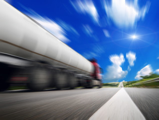 Fototapeta na wymiar Speeding Truck on the Highway. Trucking Business Concept