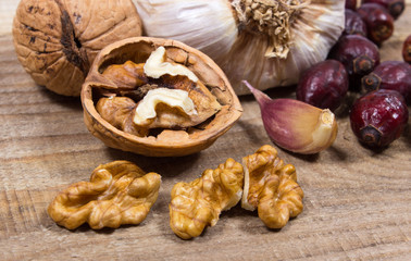 Dried fruit of hawthorn, garlic and walnuts. The concept of alternative medicine.