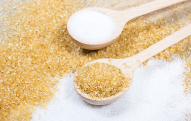 Brown sugar cane on the wooden background.