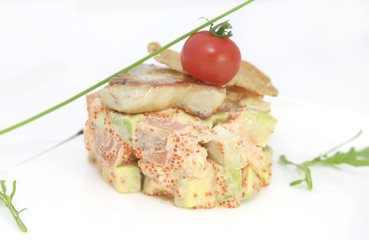 salad, fish and eggs decorated with greens and tomatoes