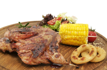 Grilled quail cooking on the grill in the restaurant