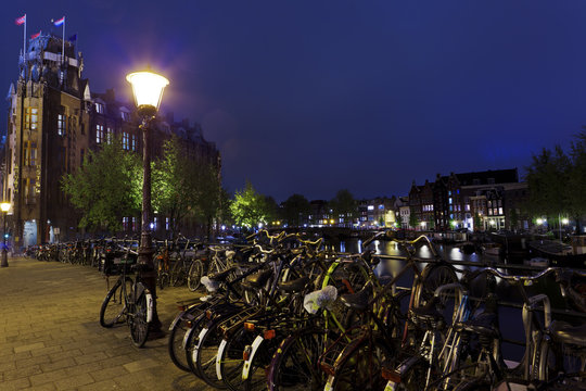 Bicycles in Amsterdam, Netherlands at night  