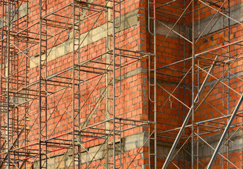 Construction of the brick wall of the building