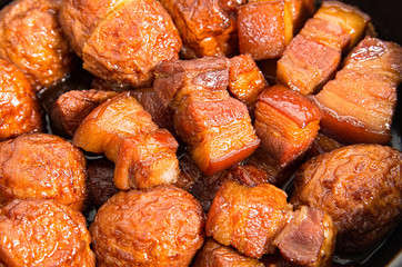 Vietnamese caramelized pork belly with deep fried eggs  in clay