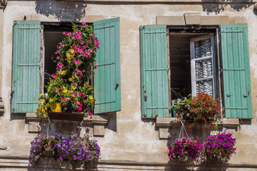 Fototapeta na wymiar Painted windows with flowers in France