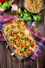 Casserole fusilli pasta with sausage, zucchini and cheese