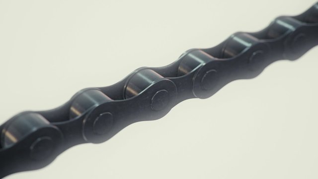 A single, infinite bike chain meanders through the frame.