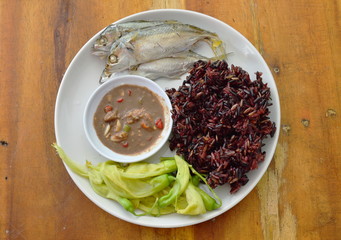 black sticky rice eat with steam mackerel and shrimp paste sauce