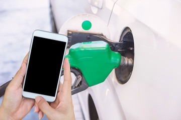 Petrol pump filling closeup, Check oil prices.