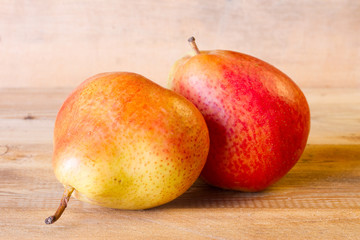 Ripe juicy pear on a wooden board