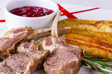 Rack of lamb with cranberry sauce and fried banan