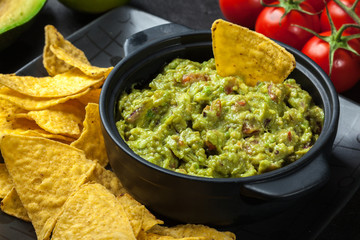 Bowl of guacamole with corn chips
