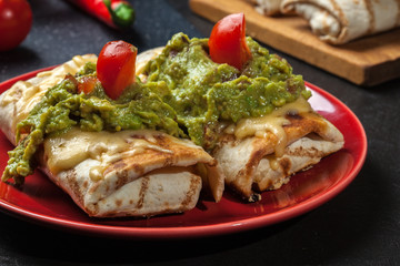 Mexican chimichanga with guacamole dip