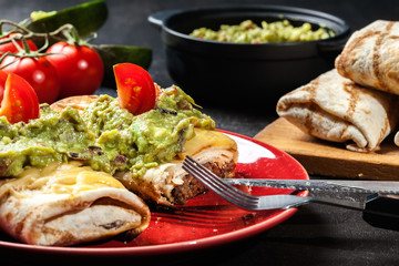 Mexican chimichanga with guacamole dip