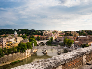 Fototapeta na wymiar A view of Rome, Italy from Castel Sant’Angelo looking southwest over the river Tiber and the Ponte Vittorio Emmanuele II bridge.