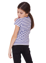 Fototapeta premium Little girl has put forefinger to lips as sign of silence