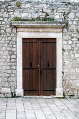Fototapeta na wymiar Old building with brown door