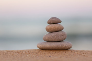 Fototapeta na wymiar Stacked Zen stones on the beach