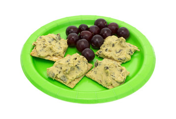 Spinach hommus on whole grain crackers with grapes